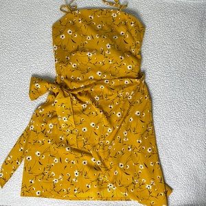 Yellow floral print wrap dress.